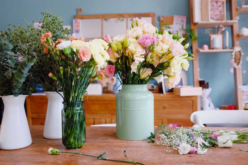 Potted plants and flowers on table