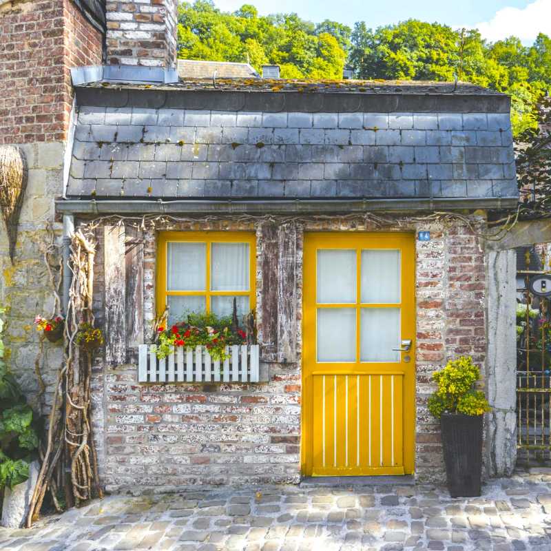 Quaint Brick Cottage with Yellow Door