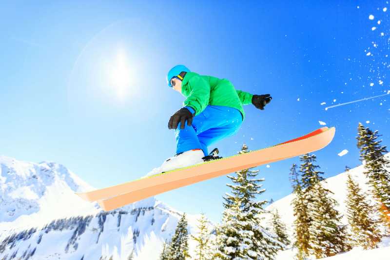 person wearing green jacket riding snow skis - jigsaw puzzle