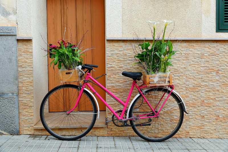 Retro Street Style Pink Bike as a Unique Outdoor Floral Display