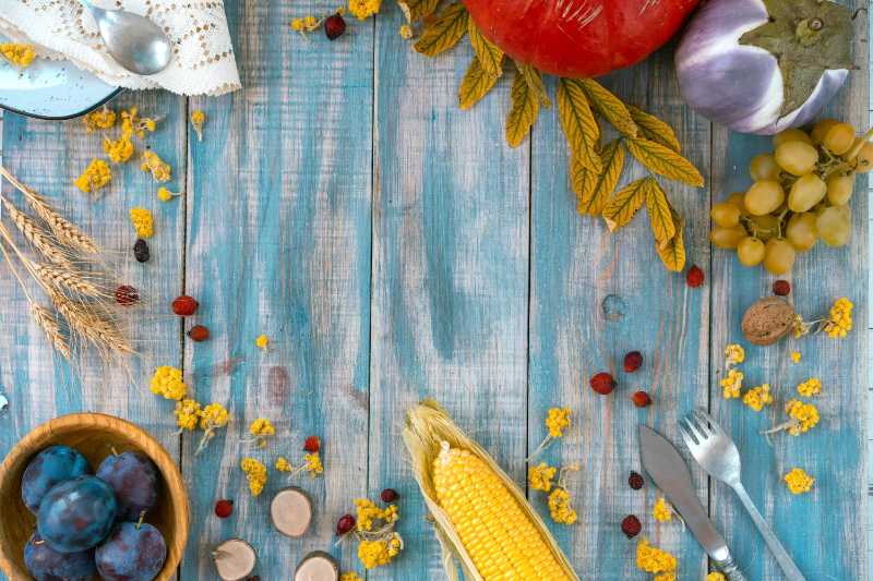 Rustic Blue Wood Background with Autumn Harvest and Fall Produce