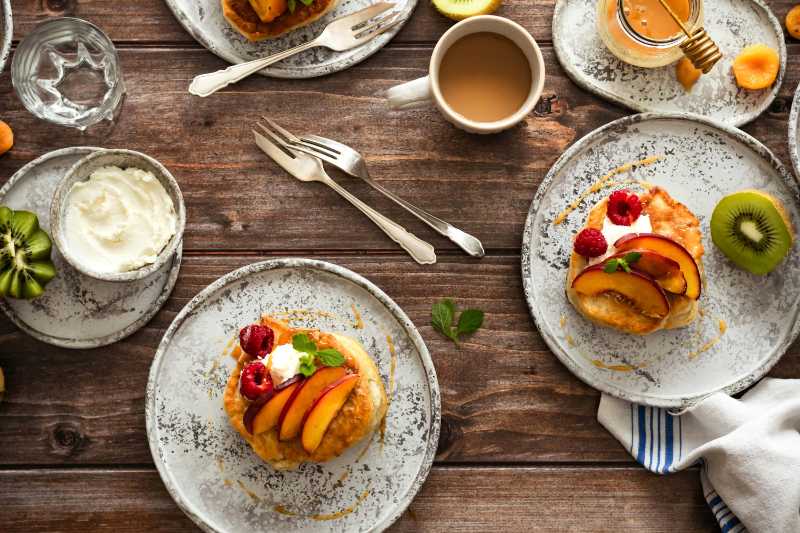 Rustic Brunch Flat Lay Pancakes with Peaches Raspberries and Coffee