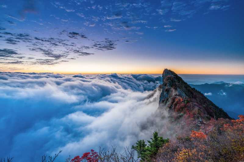 Sea of Clouds at Sunrise Majestic Mountain Peak and Autumn Foliage