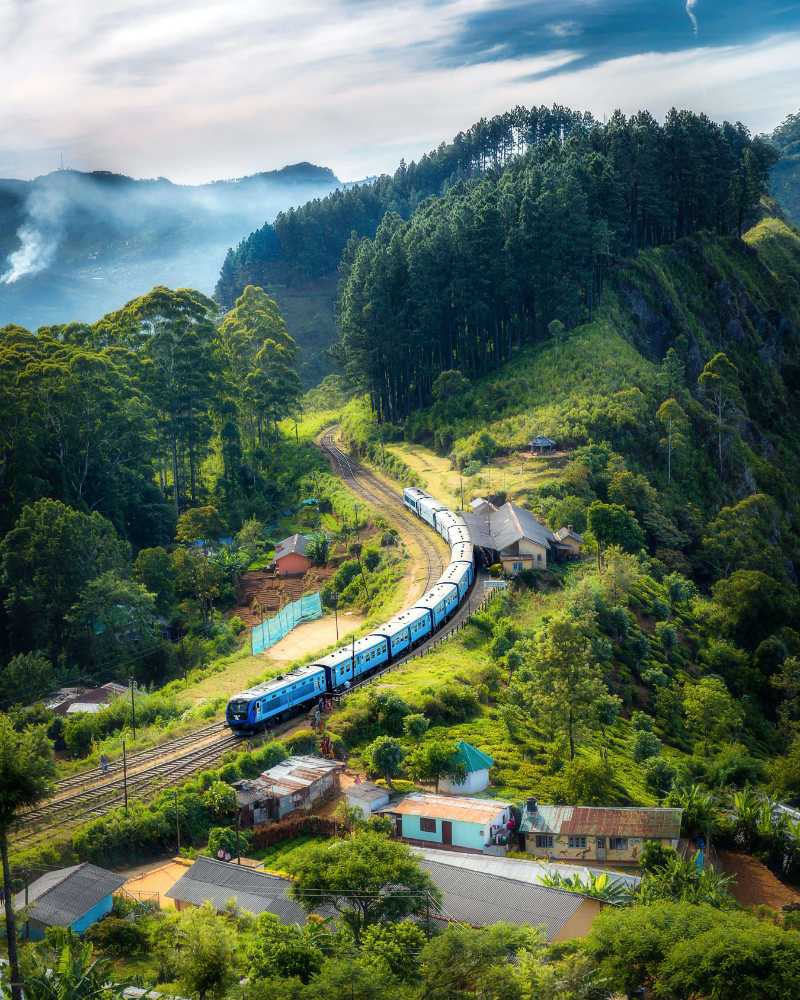 photo of railway on mountain near houses - jigsaw puzzle