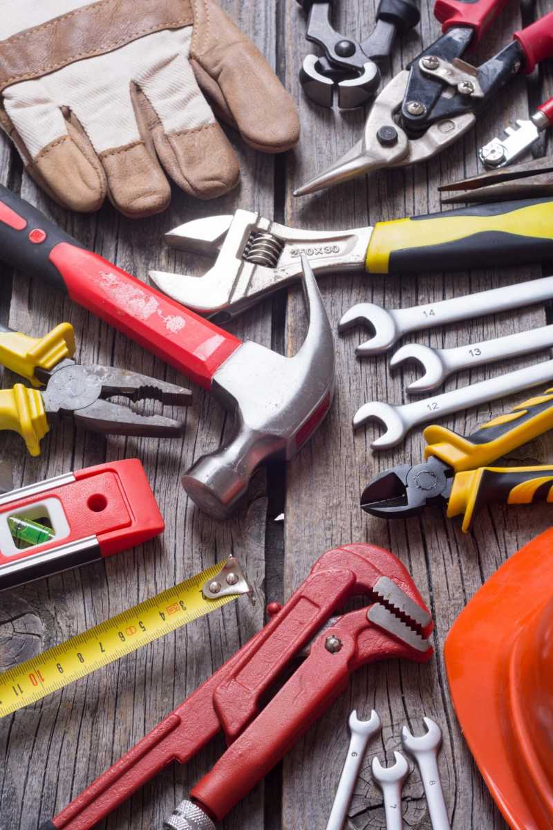 Set of tools on wooden background