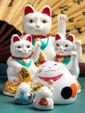 Several lucky cats placed in front of a folding fan - jigsaw puzzle