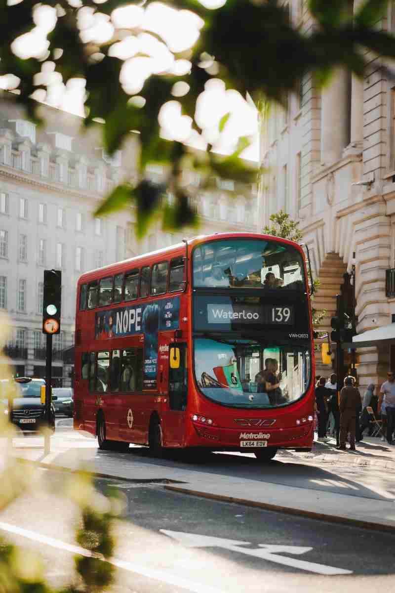 a double decker bus on the street - jigsaw puzzle