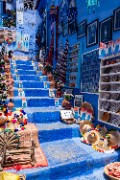 Souvenirs and decorations spread out on the blue steps - jigsaw puzzle