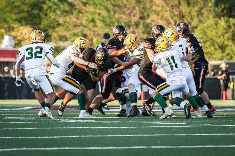 a group of football players playing a game of football - jigsaw puzzle