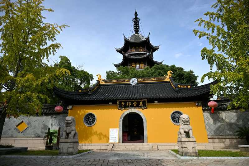 Traditional Chinese Temple with Stone Lions and Pagoda
