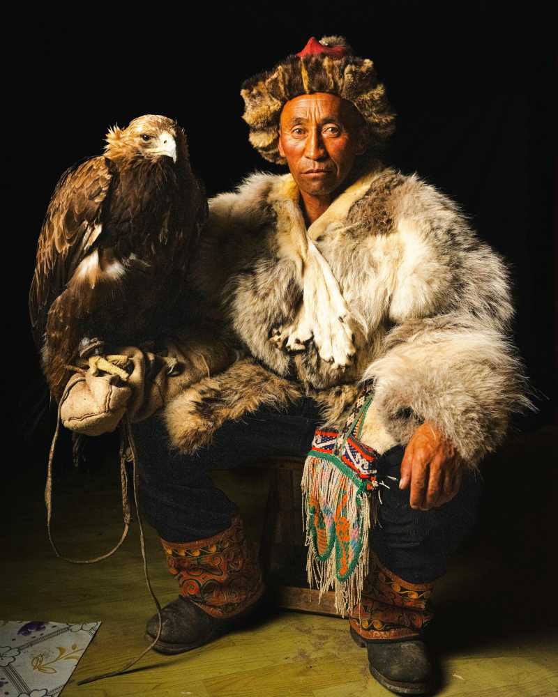Traditional Eagle Hunter in Fur Coat and Hat Mongolian Portrait