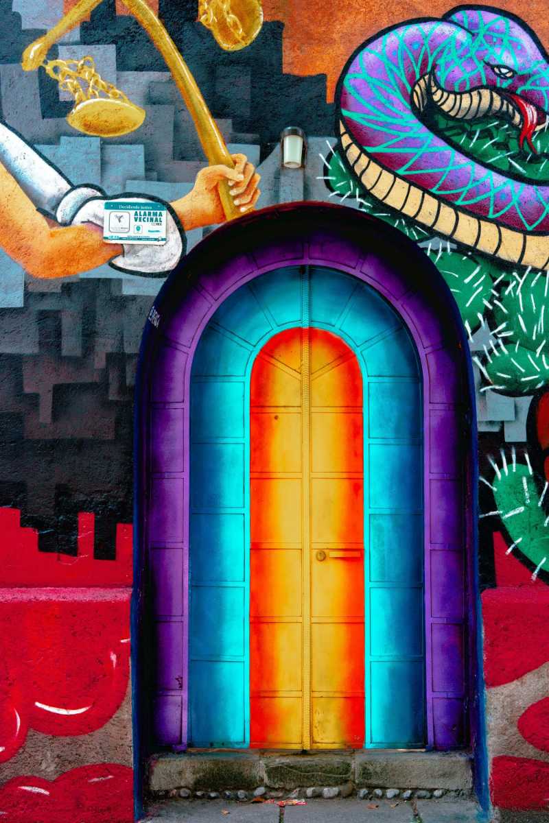 Urban Graffiti Art Justice Scales Snake and Colorful Door