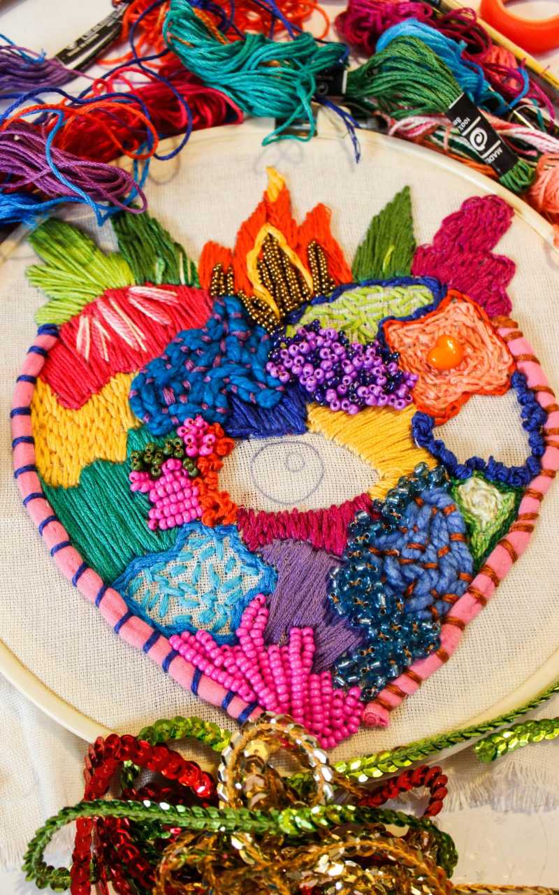 Vibrant Sacred Heart Embroidery with Beads and Textured Stitches