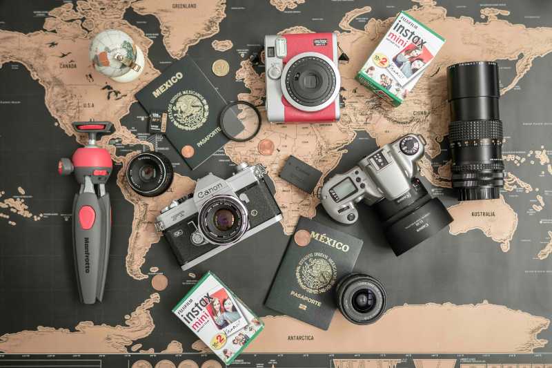 Vintage Canon Cameras and Lens on a Map Tabl
