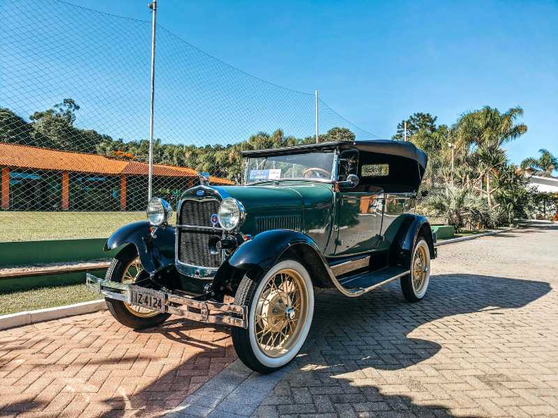 Vintage Dark Green Classic Car Outdoors on a Sunny Day