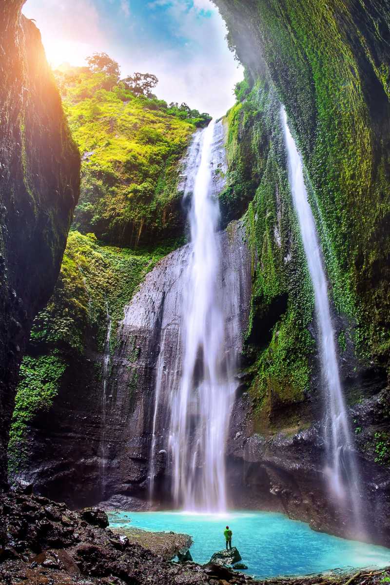 Waterfall with a Person Standing Below
