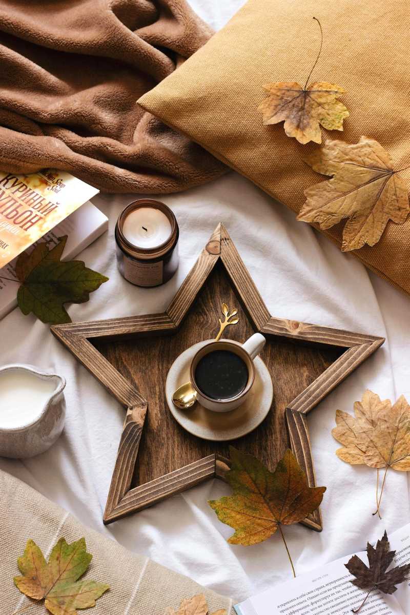 White ceramic cup on brown star shaped tray