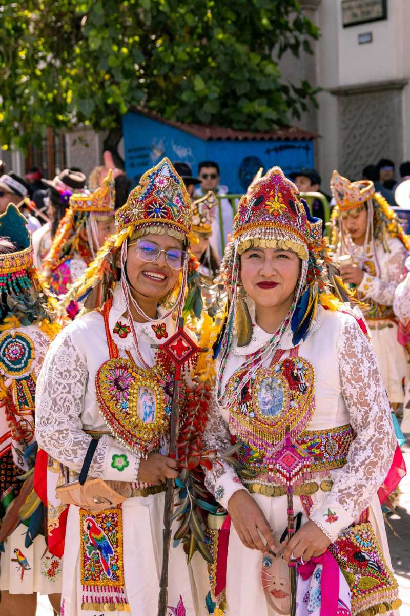 Women in traditional costumes during a parade in Peru